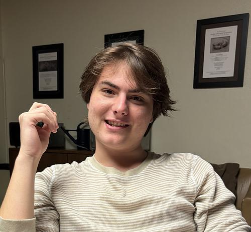 Lucas sitting in a chair facing the camera